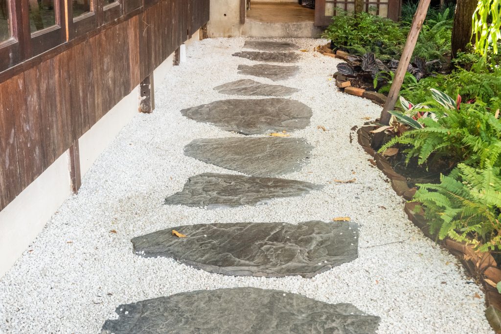 A beautifully installed flagstone walkway on a concrete base.