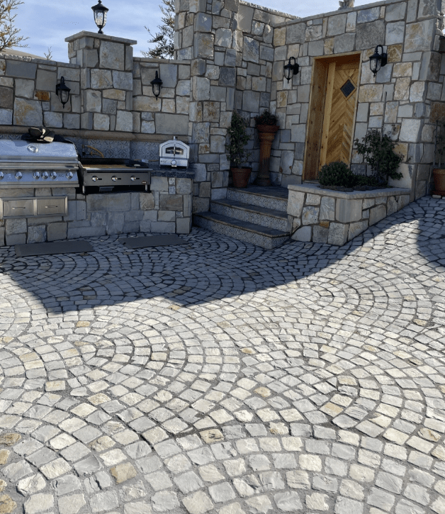 Cobblestone walkway maintained and weed-free in a garden