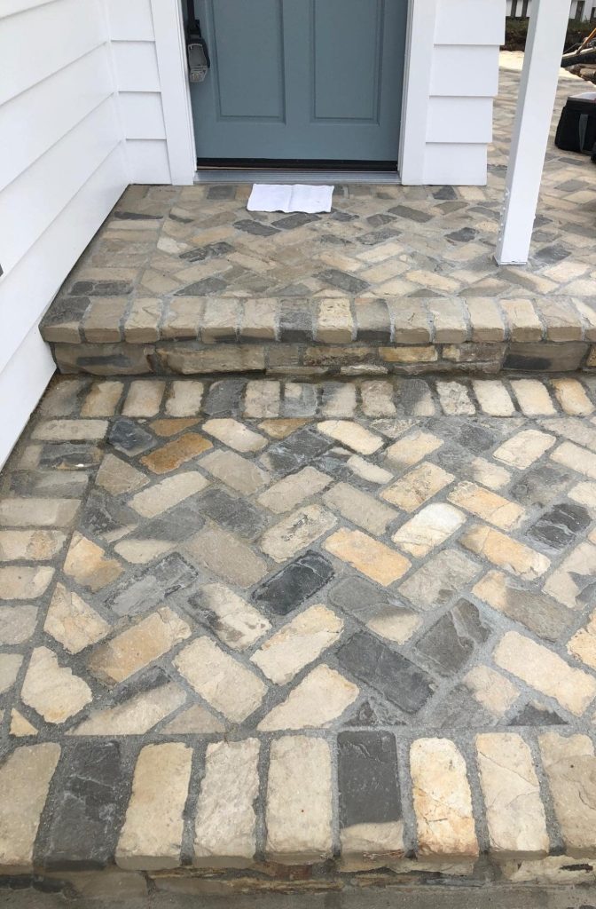 Cobblestone walkway maintained and weed-free in a garden